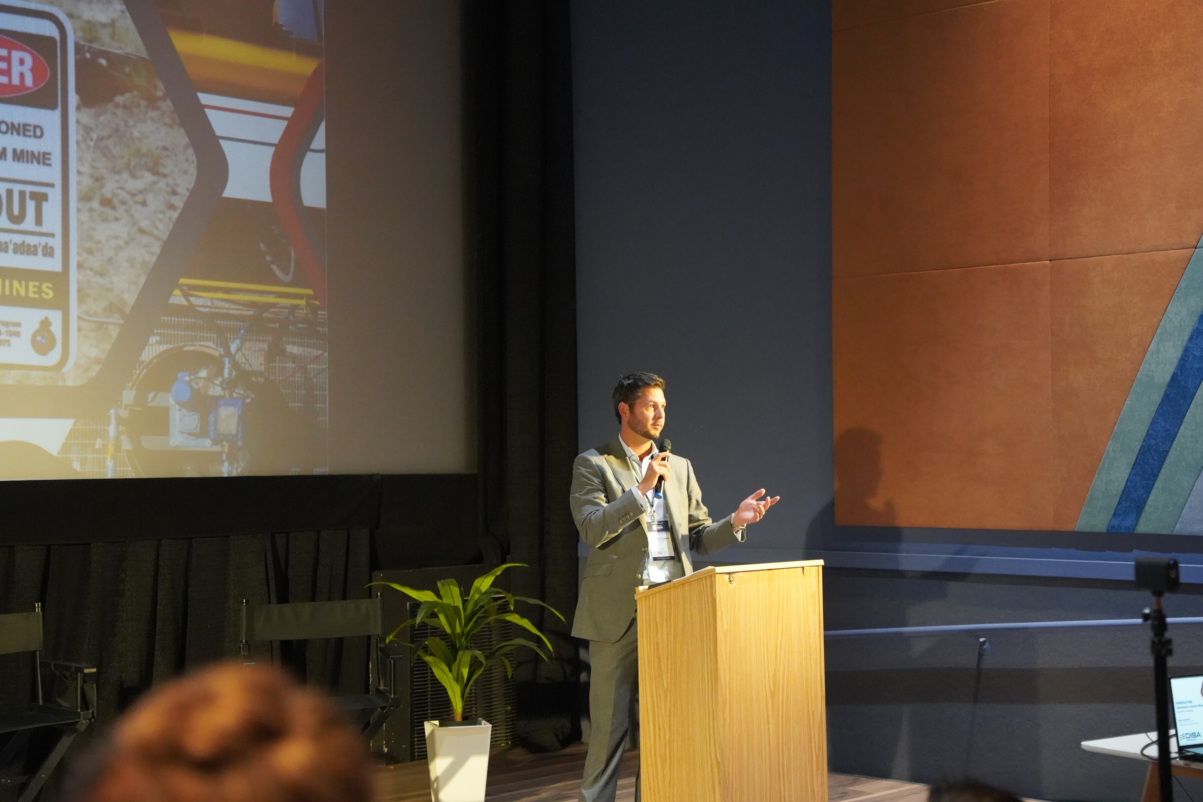 Speaker presenting at the forum podium