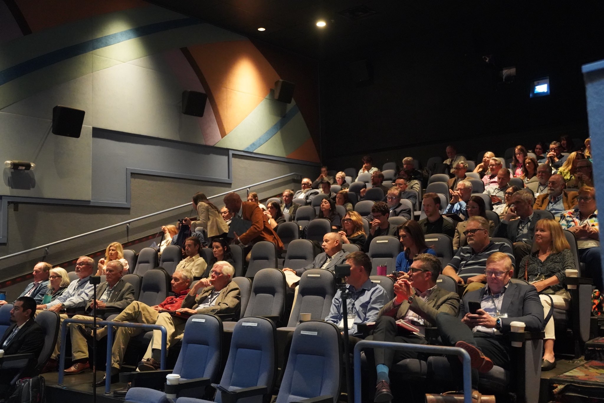 Audience seated in the theater auditorium during the Los Alamos Nuclear Forum